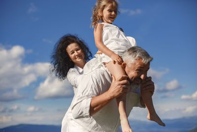 Grandparents enjoying time with a grandchild in retirement
